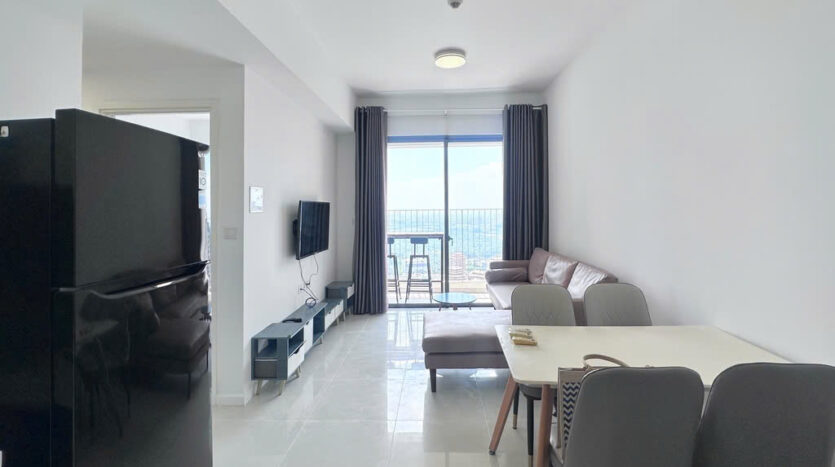 Modern kitchen with white gloss cabinets and integrated appliances at Masteri An Phu Tower B