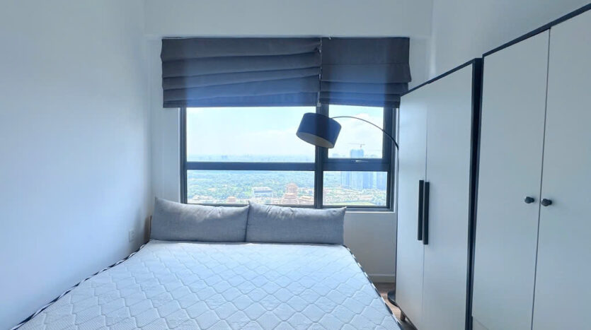 Second bedroom with city skyline view at Masteri An Phu Tower B apartment