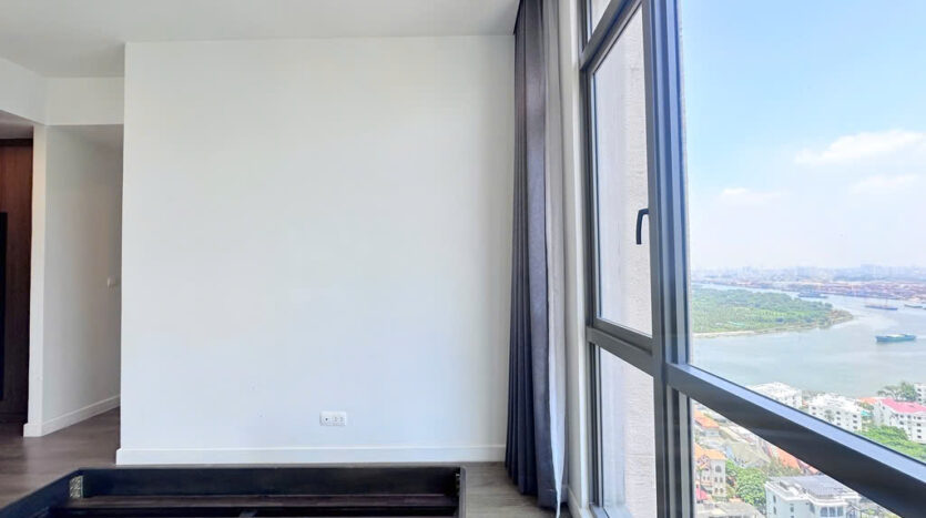 Modern bedroom with wood floor at The Nassim Tower A apartment