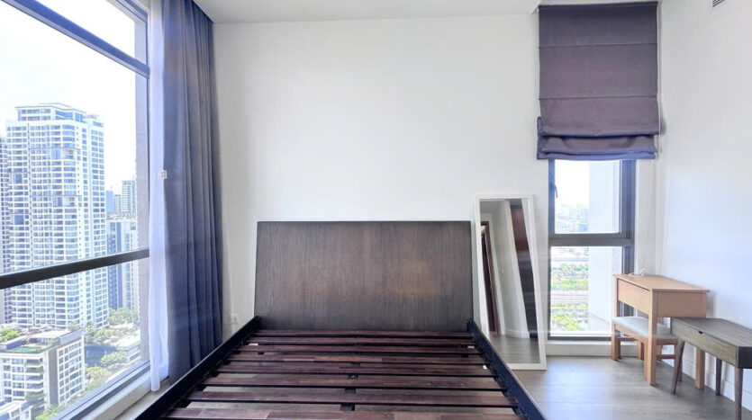 Master bedroom with view of neighboring towers at The Nassim Tower A apartment