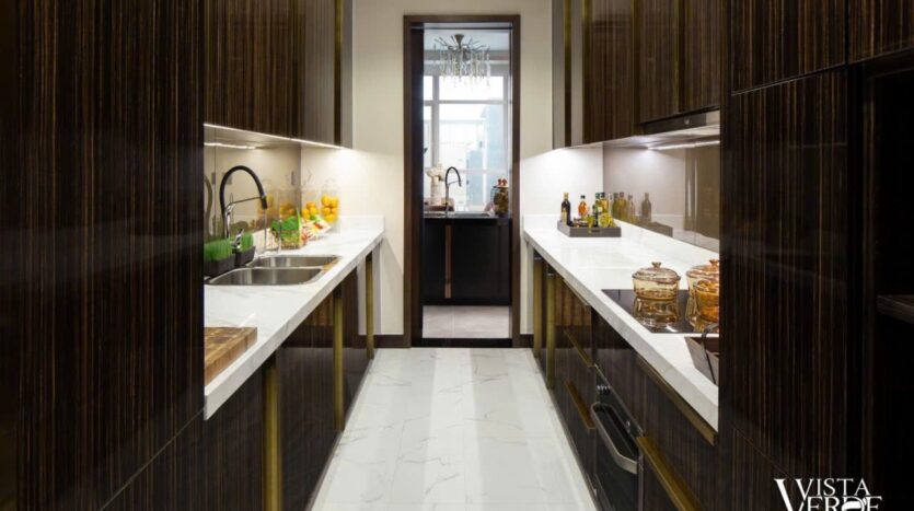 Bếp song song tủ gỗ cao cấp penthouse Sky Mansion Vista Verde | Galley kitchen with premium wood cabinetry, Sky Mansion penthouse Vista Verde