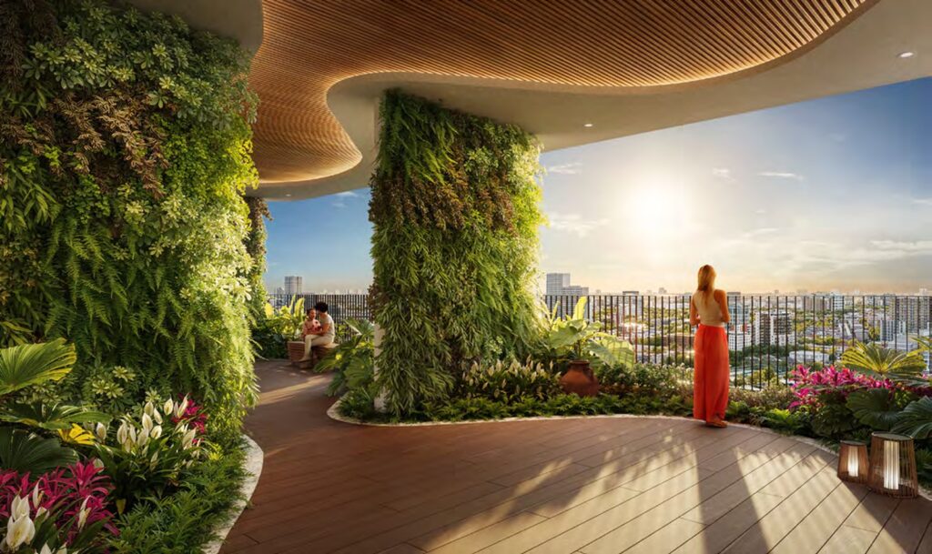 Vườn trên cao tại Green Skyline Dĩ An với tường cây xanh, sàn gỗ và tầm nhìn mở ra thành phố lúc hoàng hôn | Sky garden at Green Skyline Di An with green walls, timber decking and an open city view at sunset