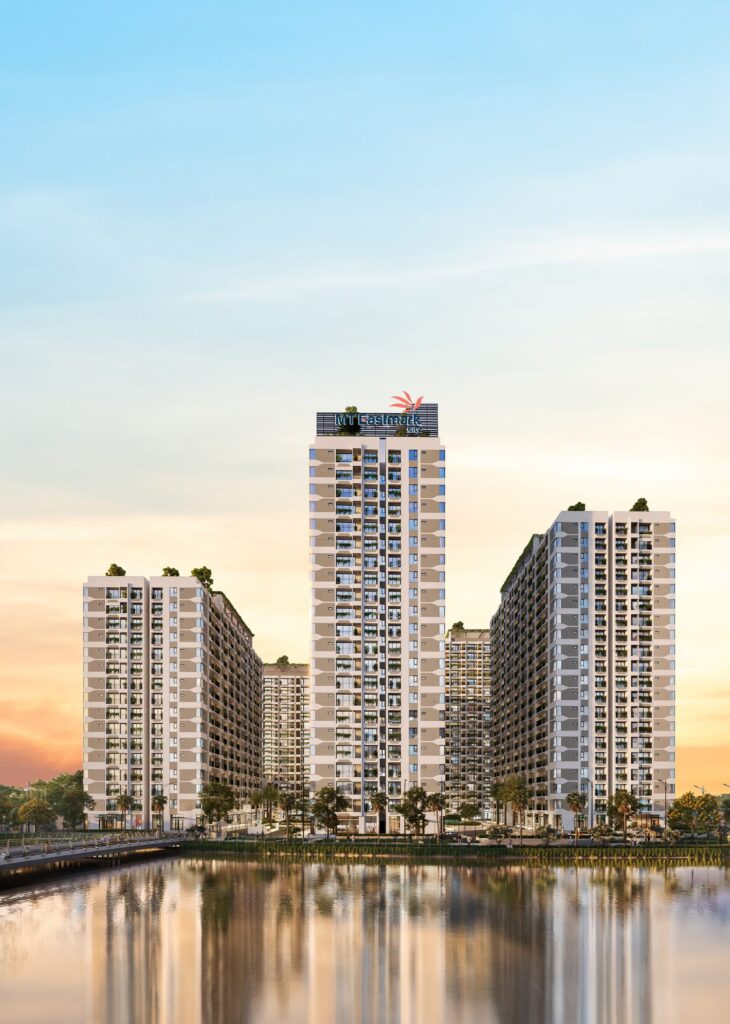 Phối cảnh tổng thể MT Eastmark City nhìn từ hồ cảnh quan với các toà tháp căn hộ và đường dạo ven hồ | MT Eastmark City overall rendering seen from the landscape lake showing residential towers and the lakeside promenade
