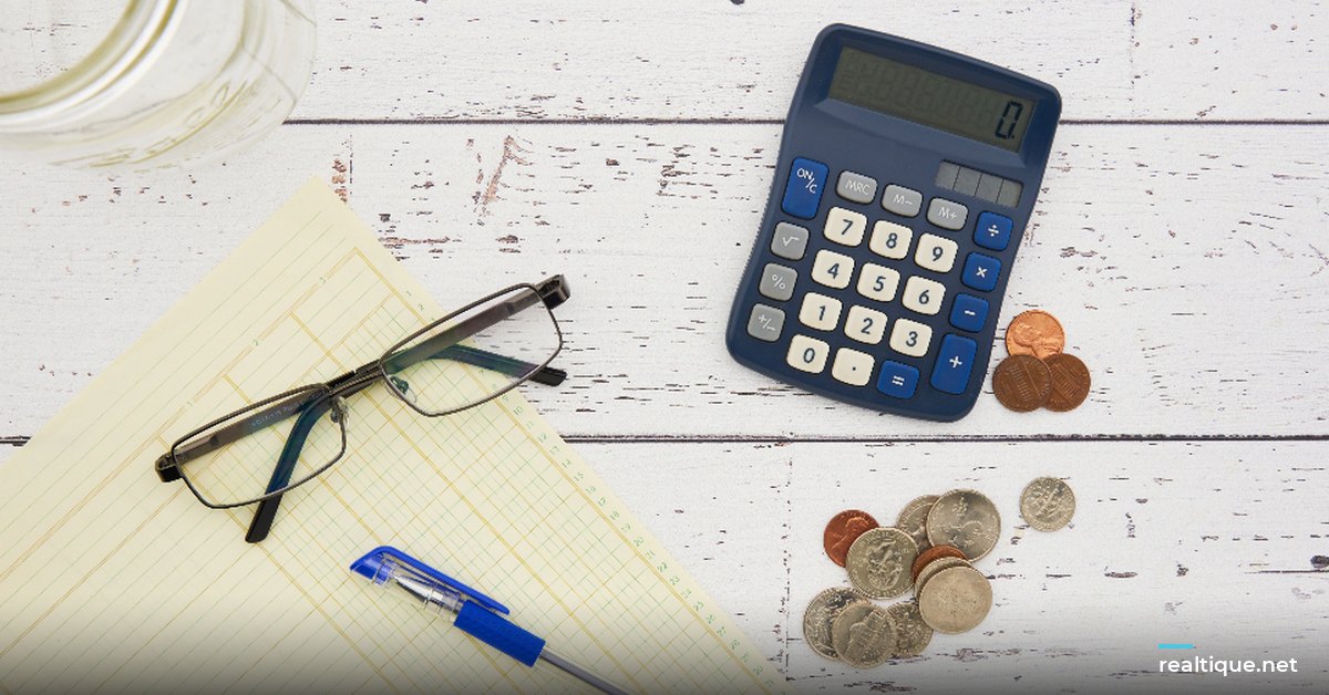 Calculator, coins and paperwork