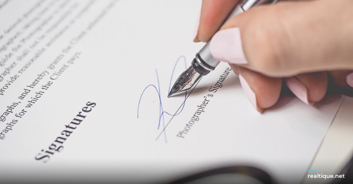 Signing a contract with a fountain pen