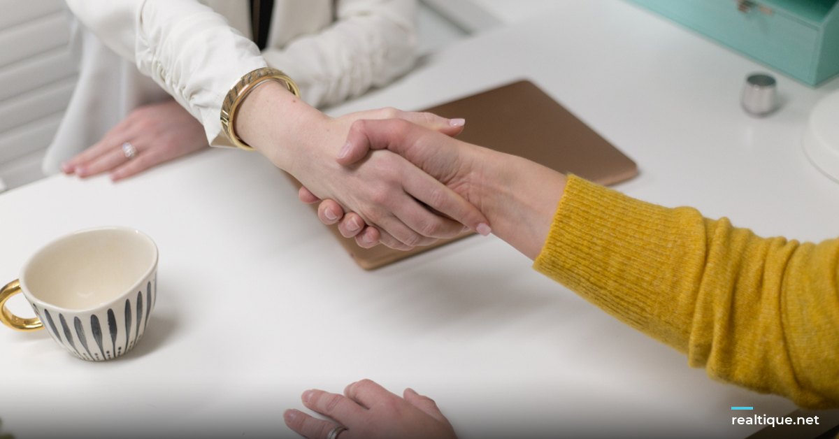 Handshake over a desk